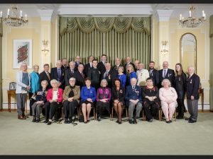 Back row, fourth from the right, Graham Robertson stands with the rest of the local islanders who were recently honoured with the Sovereigns Medal for Volunteer Service.