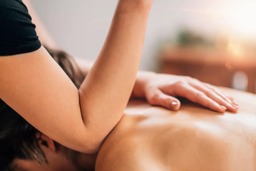 Massage therapist working on a shoulder