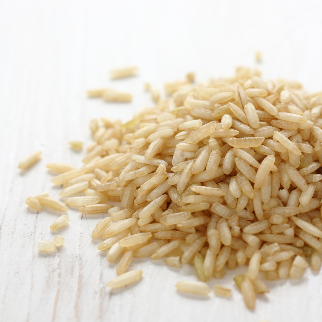 Small pile of brown rice on a table