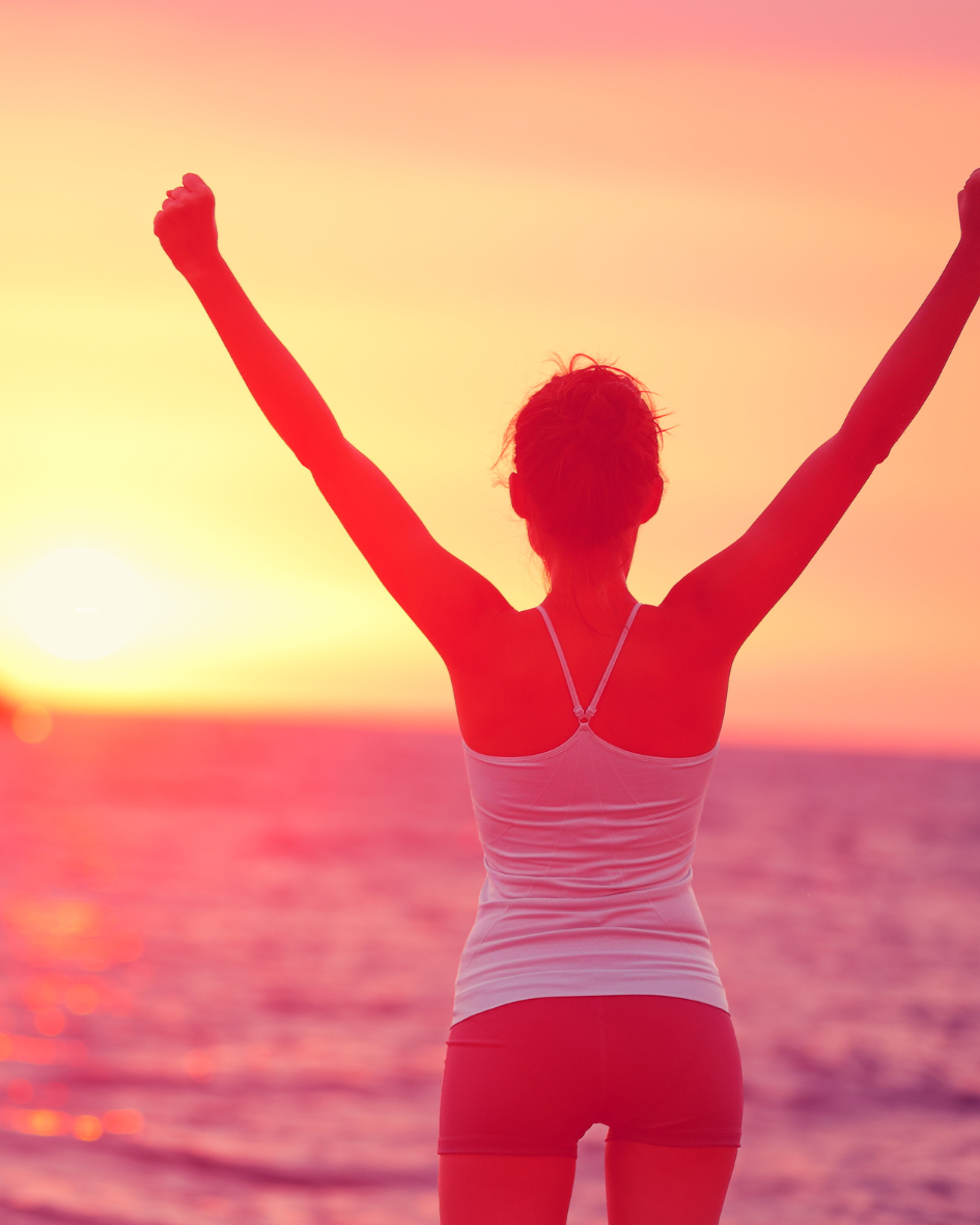 Woman celebrating with arms raised