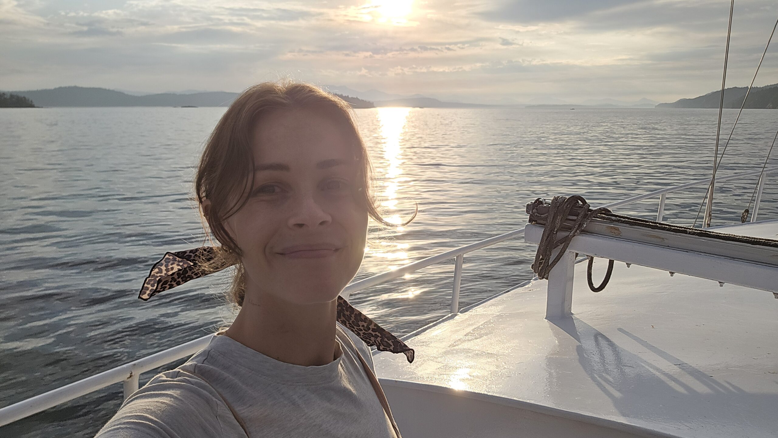 Shawna on a sailboat at sunset