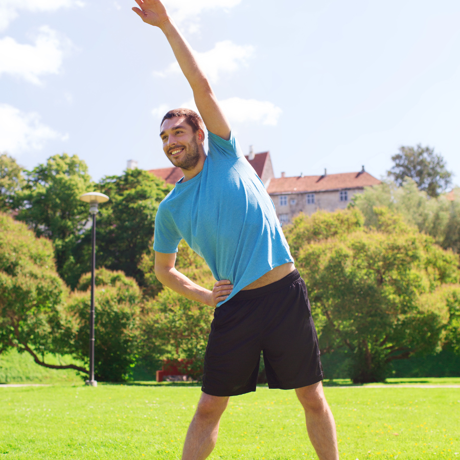 Man stretching back in the park