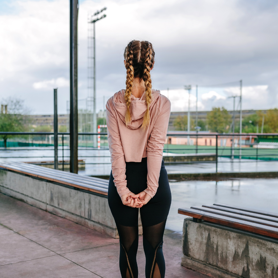 Woman stretching shoulders with arms behind back
