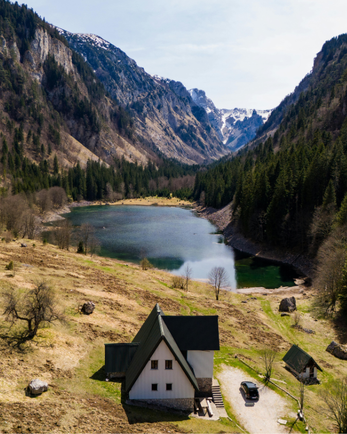 Rural house by a small lake and forest