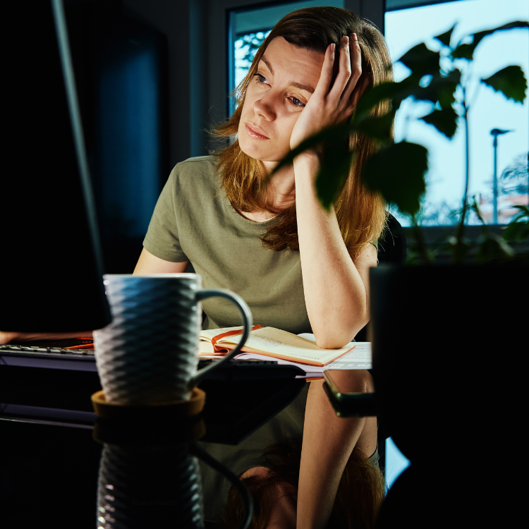 Woman working late at her desk