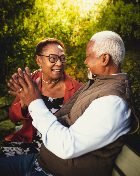 Couple holding hands and smiling