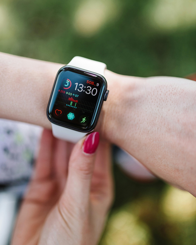 Woman checking health stats on smart watch