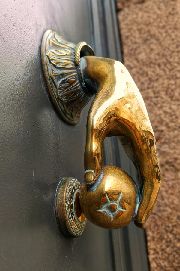 Spanish door knocker in the shape of a hand