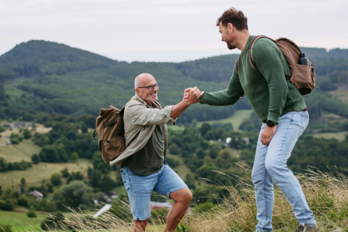 Two men hiking up a mountain