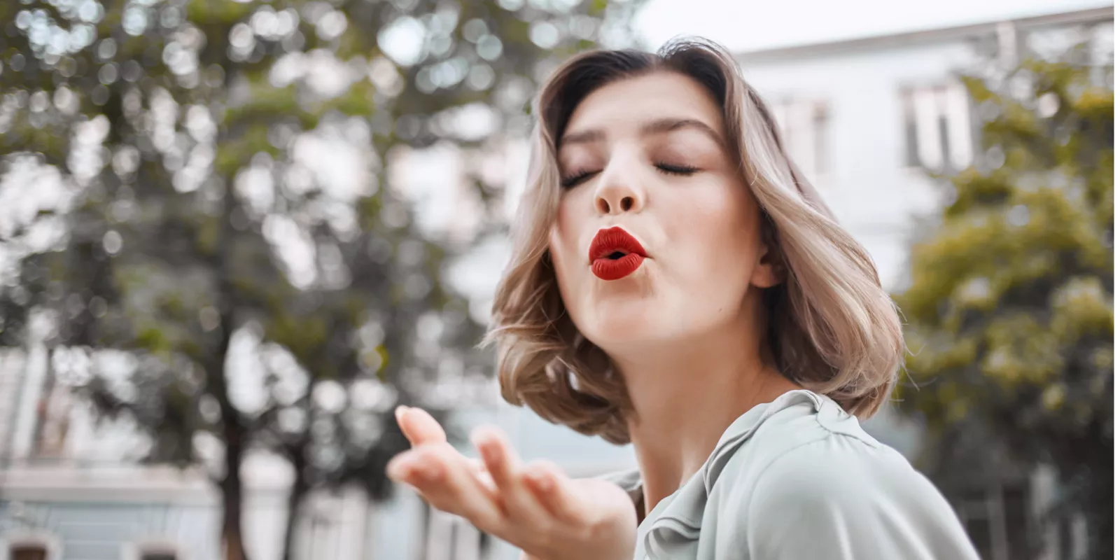 Woman blowing a kiss