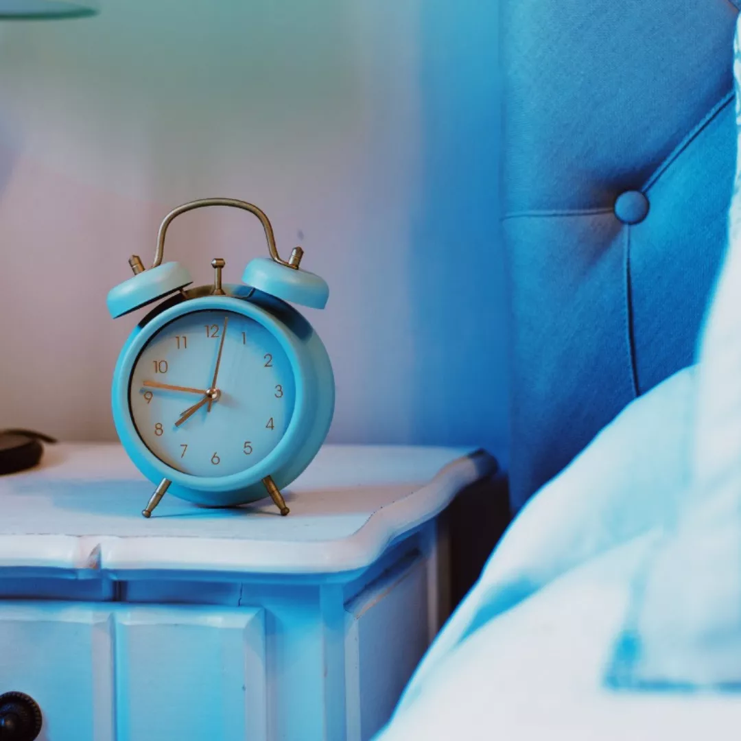 Alarm clock sitting on bedside table