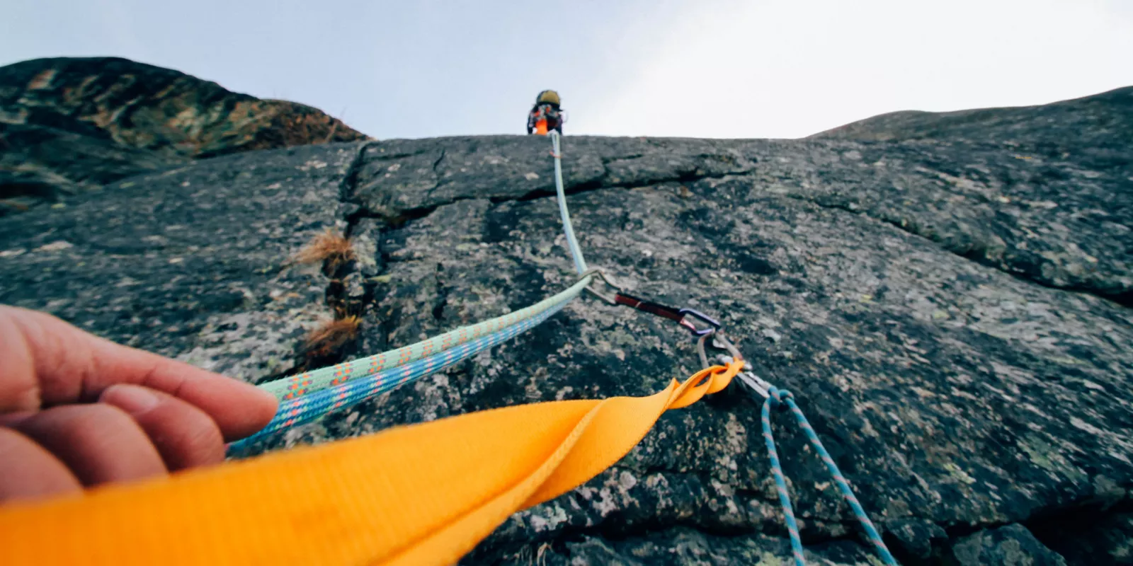 View up a rock face while rock climbing