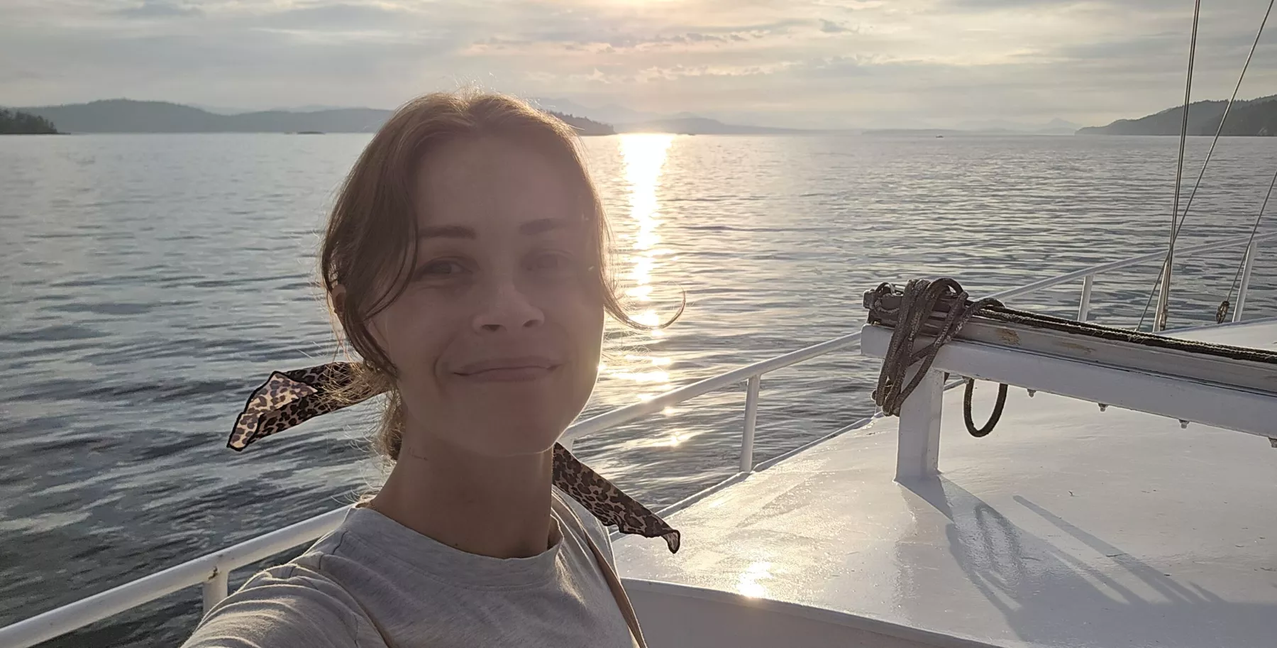 Shawna on a sailboat at sunset
