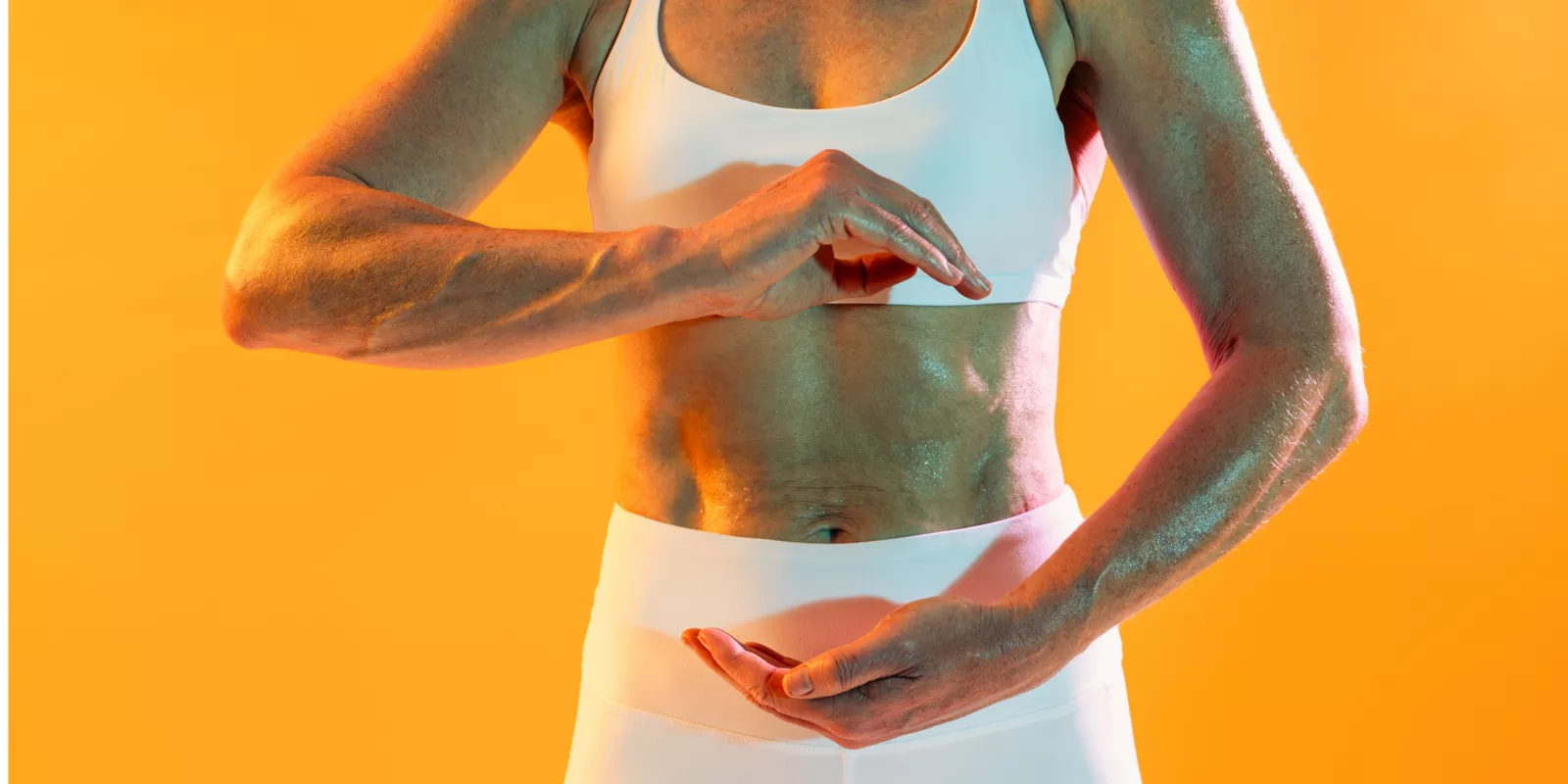 Woman doing tai chi with flexed abs