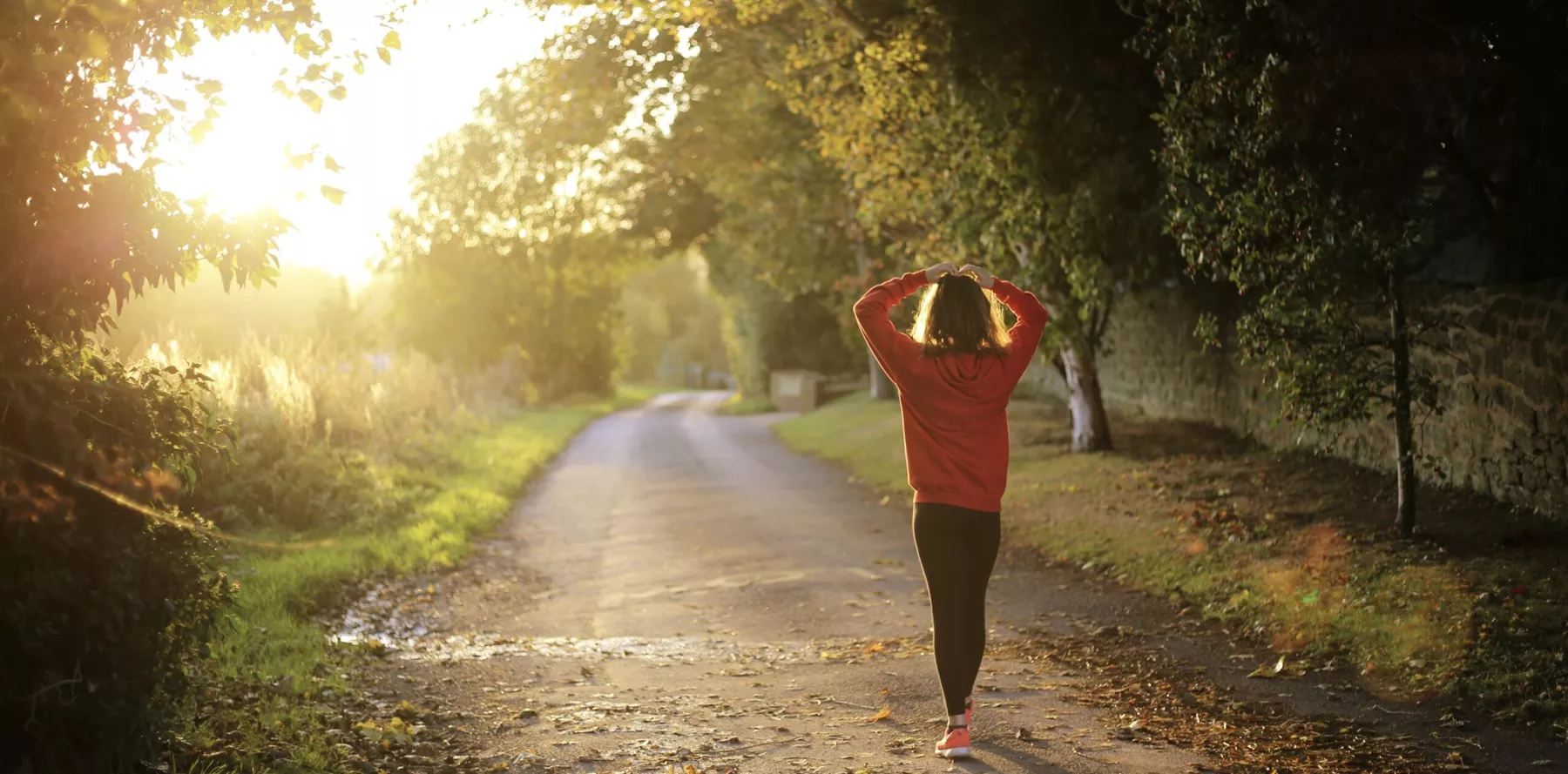 Woman walking down a trail