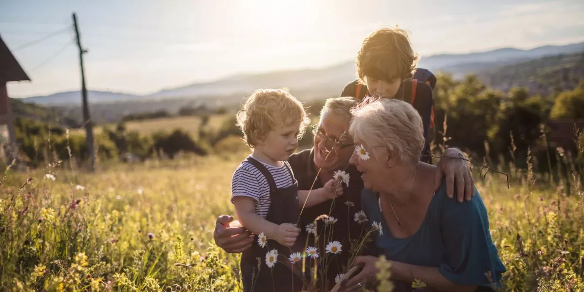 Grandparents playing with children