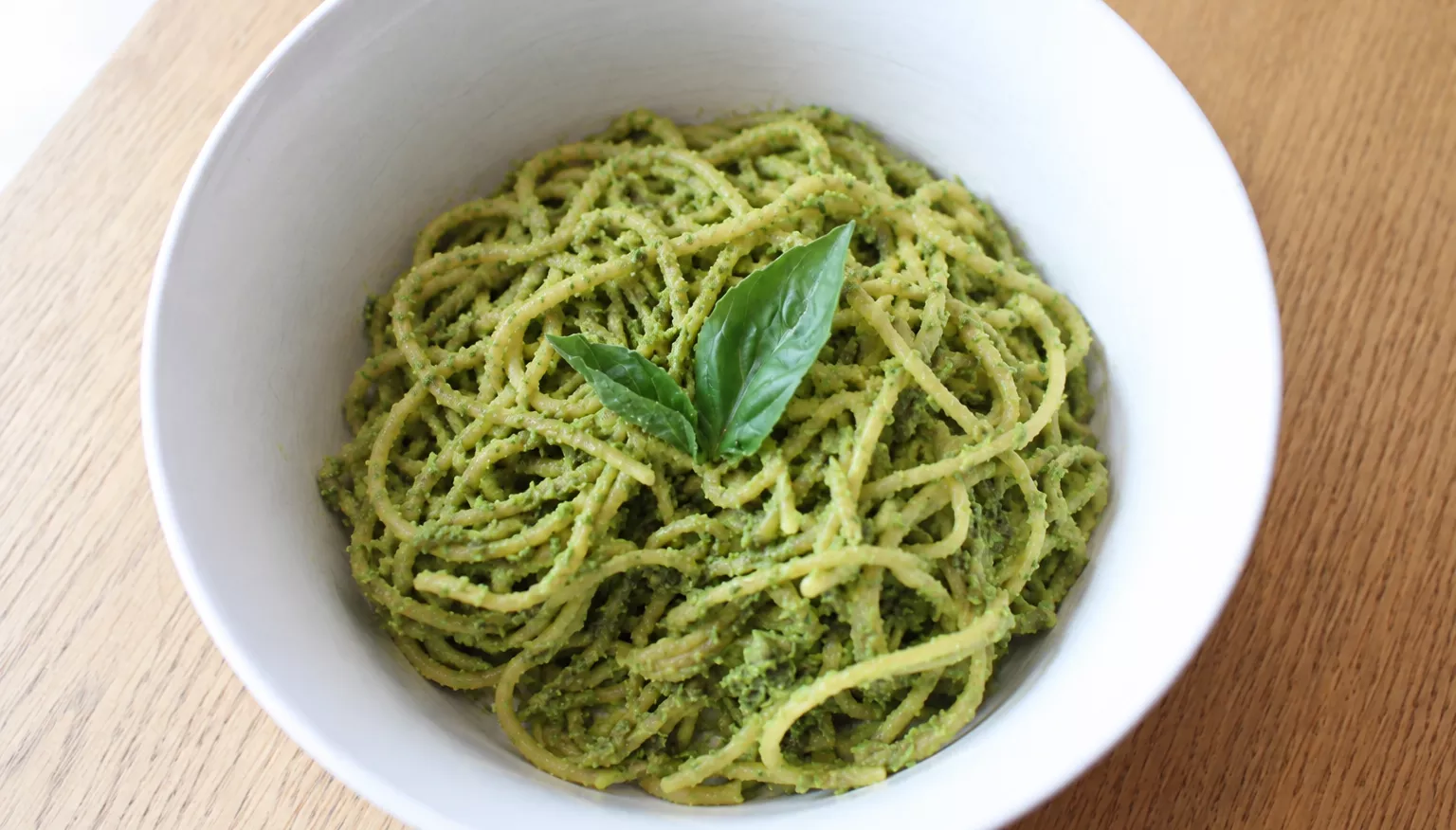 Bowl of pasta with green pesto