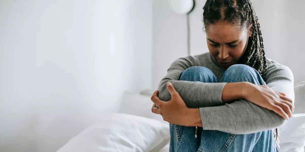 Woman sitting with pain