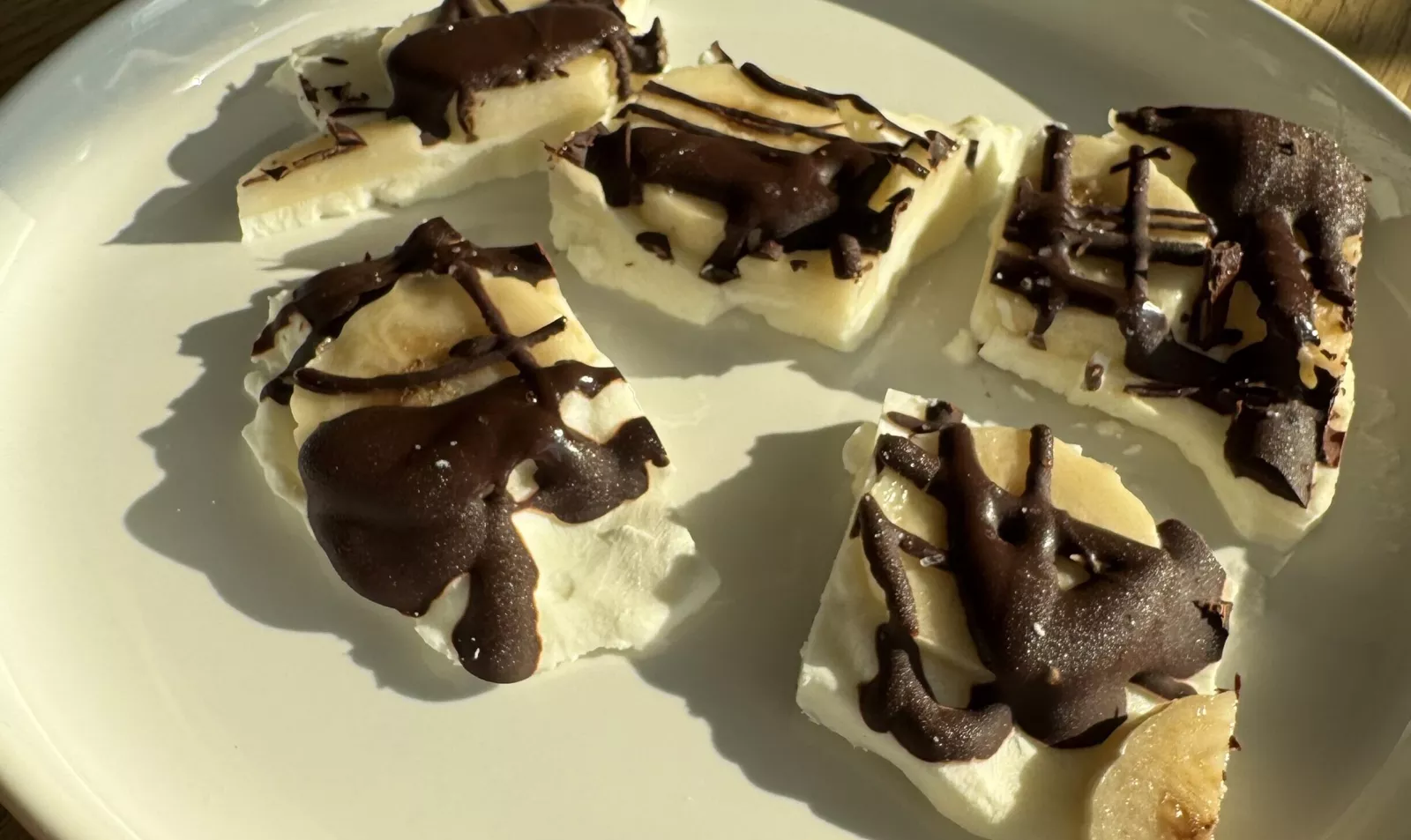 Frozen yogurt bark on a plate